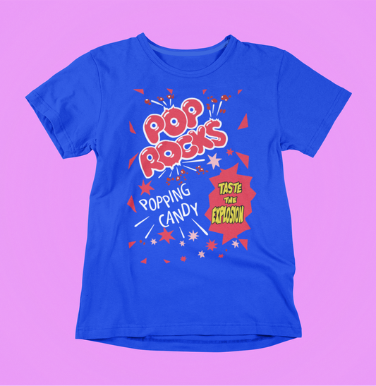 Royal Blue t-shirt with Pop Rocks popping candy graphic on a pink background
