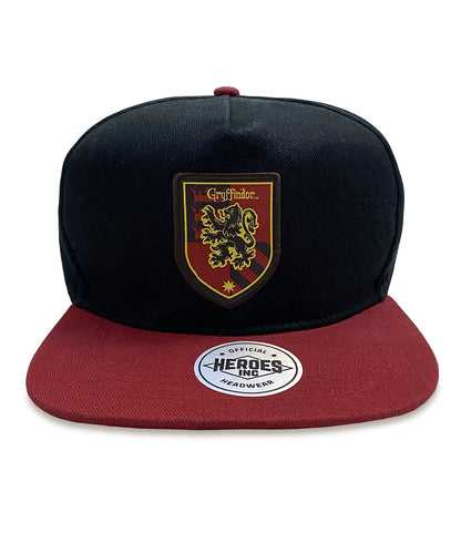 A black unisex snapback cap with a red brim, featuring the Gryffindor house badge from the Harry Potter series.