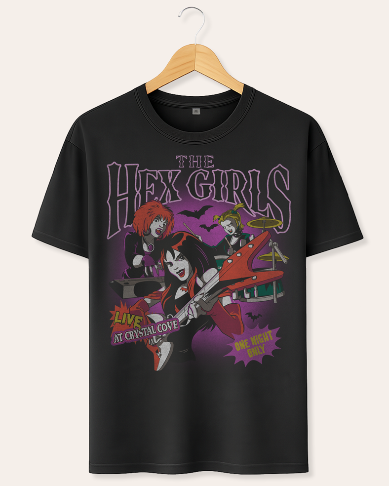 Official Scooby Doo Black t-shirt with 'The Hex Girls' graphic design on a hanger against a white background