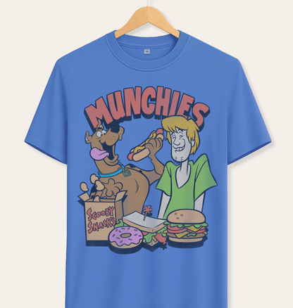 Official Scooby Doo Blue t-shirt with cartoon characters Shaggy and Scooby eating Scooby snacks and 'MUNCHIES' text above,  on a hanger against cream background