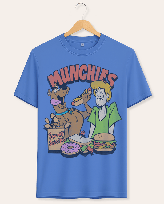 A blue short-sleeve t-shirt on a wooden hanger, featuring a colorful cartoon graphic of Scooby-Doo and Shaggy with the word 'MUNCHIES' above them.