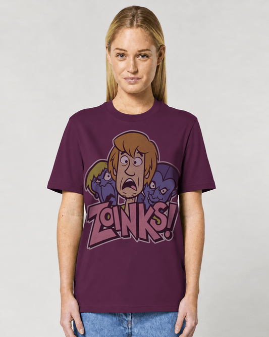 A woman modeling a deep plum graphic t-shirt featuring cartoon Scooby Doo characters and the text 'ZOINKS!' on the front, set against a plain light gray background.