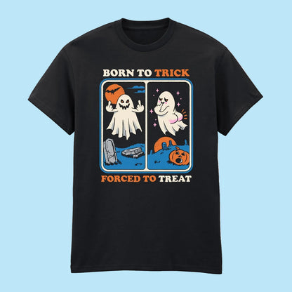 A black short-sleeve crewneck t-shirt with a retro Halloween graphic on the chest. The graphic features the text 'BORN TO TRICK' above a split-panel illustration of a ghost and a trick-or-treat scene, with 'FORCED TO TREAT' below.