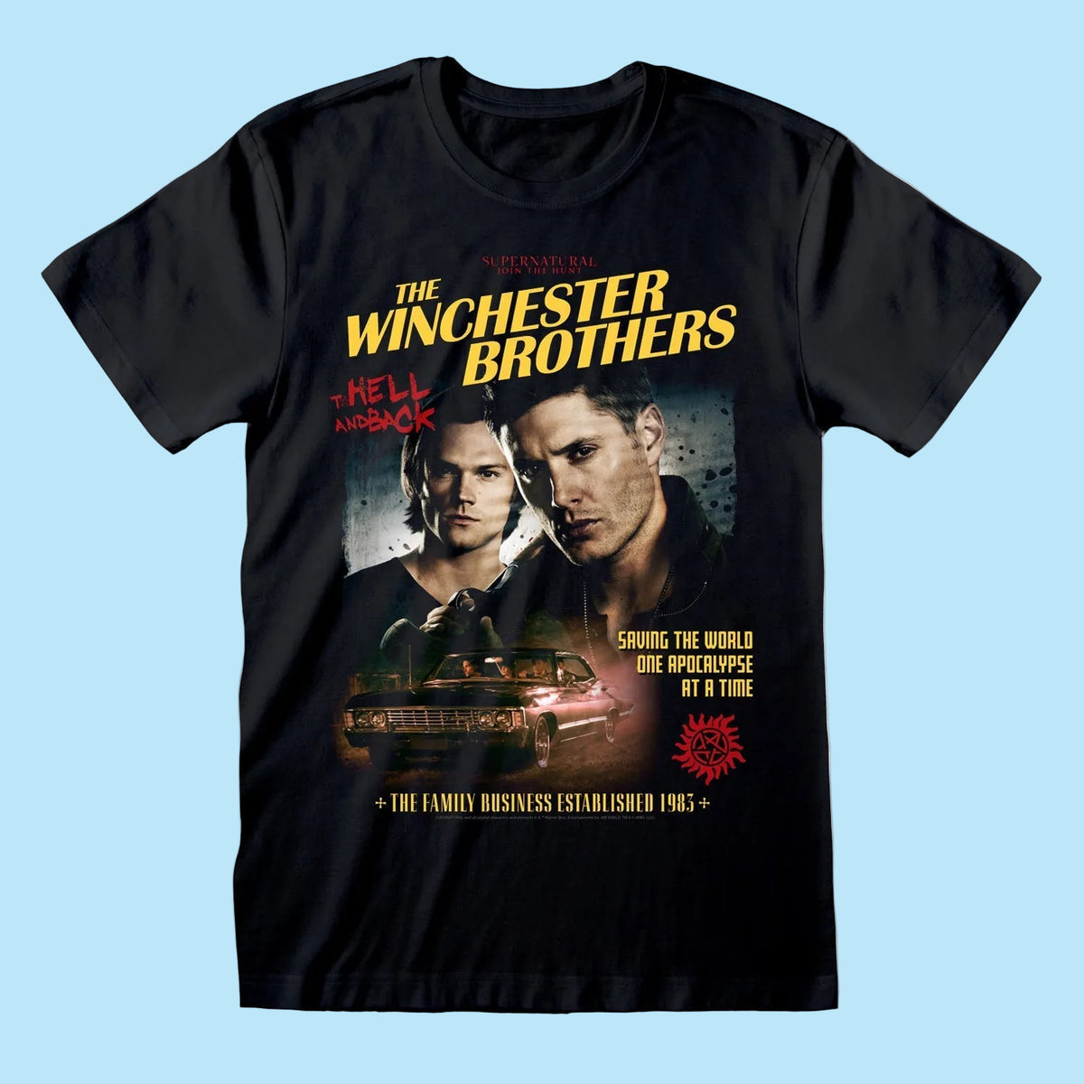 A black short-sleeve crewneck t-shirt featuring a graphic print of 'The Winchester Brothers: Hell on Earth' from Supernatural. The graphic includes the show's title in yellow, a portrait of Dean Winchester, Sam Winchester, a car, and red and yellow text.