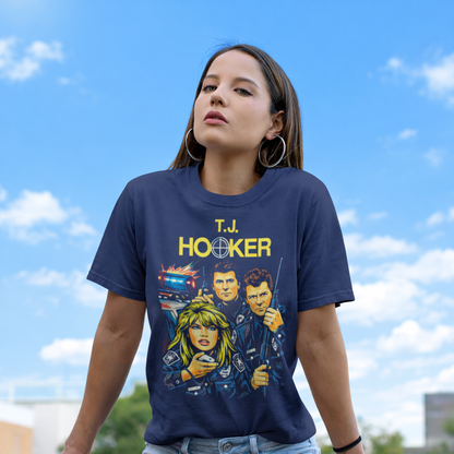 Person wearing a navy blue t-shirt with 'T.J. Hooker' graphic design against a blue sky.