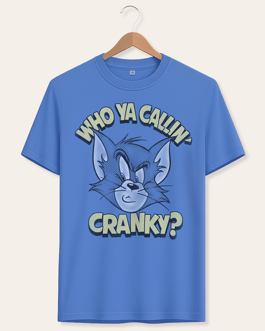 Official Tom and Jerry Blue t-shirt with cartoon Tom character and Who Ya Callin' Cranky? text on a hanger against a white background
