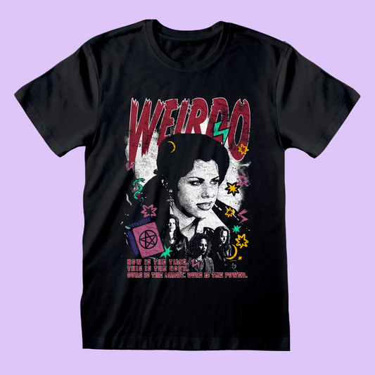 A black short-sleeve graphic t-shirt featuring a stylized portrait of The Craft character and 'WEIRDO' in distressed red letters above, surrounded by colorful occult and retro-style illustrations.