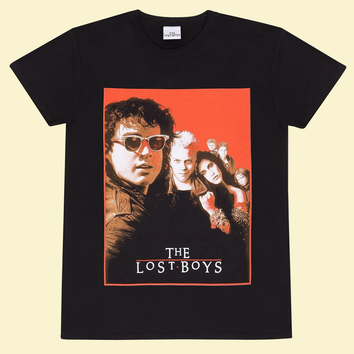 A black short-sleeve graphic t-shirt featuring a vintage-style poster print of the band 'The Lost Boys' on the front