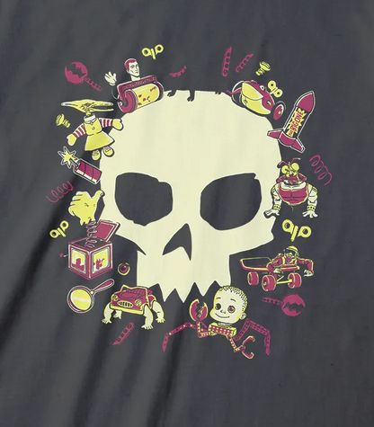 A dark charcoal gray t-shirt featuring a central graphic of a cream-colored skull surrounded by a colorful collection of small cartoon items,