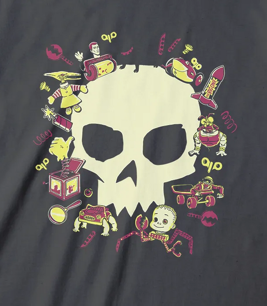 A dark charcoal gray t-shirt featuring a central graphic of a cream-colored skull surrounded by a colorful collection of small cartoon items,