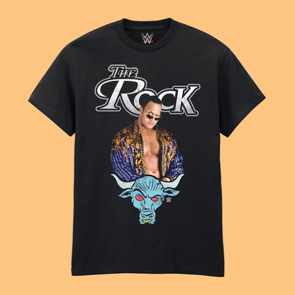 A black short-sleeve crewneck t-shirt featuring a graphic print of WWE wrestler with the text 'The Rock' and a blue bull head illustration below, shown 