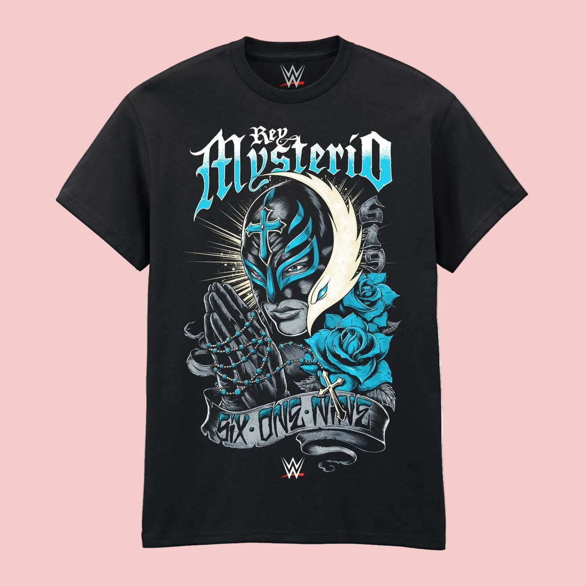 A black short-sleeve crewneck t-shirt featuring a large graphic print of the wrestler Rey Mysterio. The graphic includes his name in stylized blue and white lettering, a mask, praying hands, blue roses, and a banner reading 'Six One Nine'.