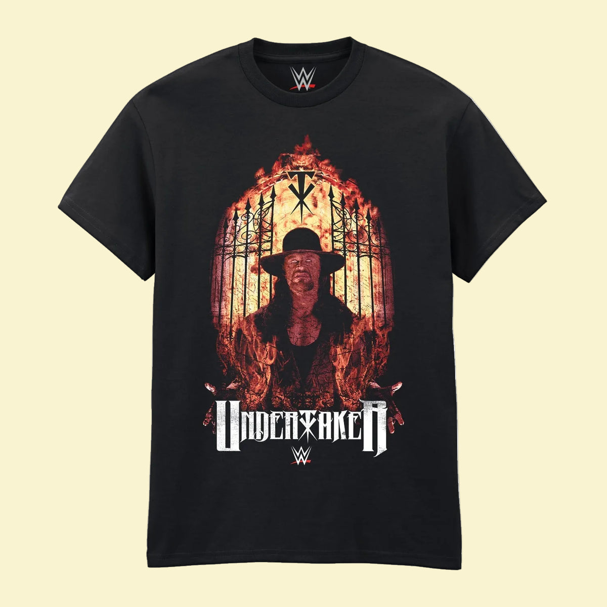 A black short-sleeve crewneck t-shirt featuring a large graphic print of the wrestler Undertaker surrounded by flames, with the 'UNDERTAKER' name and WWE logos printed below.