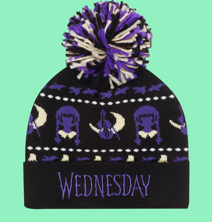 Black knit beanie with purple and white patterns and 'WEDNESDAY' text on a white background