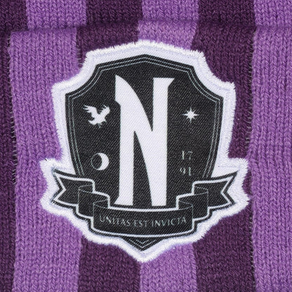 Official Wednesday Purple striped beanie with pom-pom and Nevermore logo on a white background