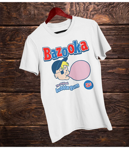 White short sleeve t-shirt with Bazooka bubble gum graphic on a wooden background