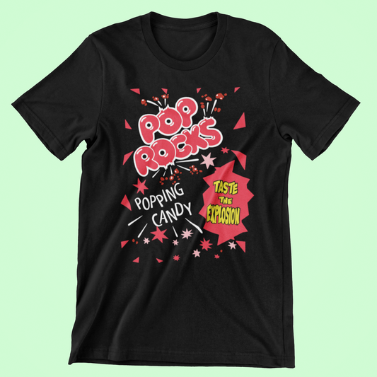 Black short sleeve t-shirt with colourful 'Pop Rocks' popping candy graphic on a light green background