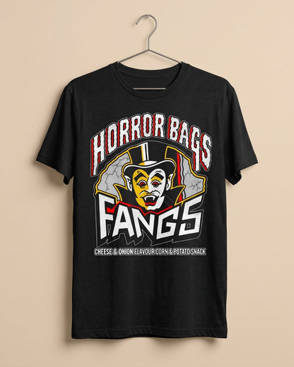 A black short-sleeve t-shirt hanging on a metal hanger against a solid beige background. The shirt features a large graphic print on the front with the words 'HORROR BAGS FANGS' in stylized red, white, and black lettering, and a cartoon vampire face inside a top hat.