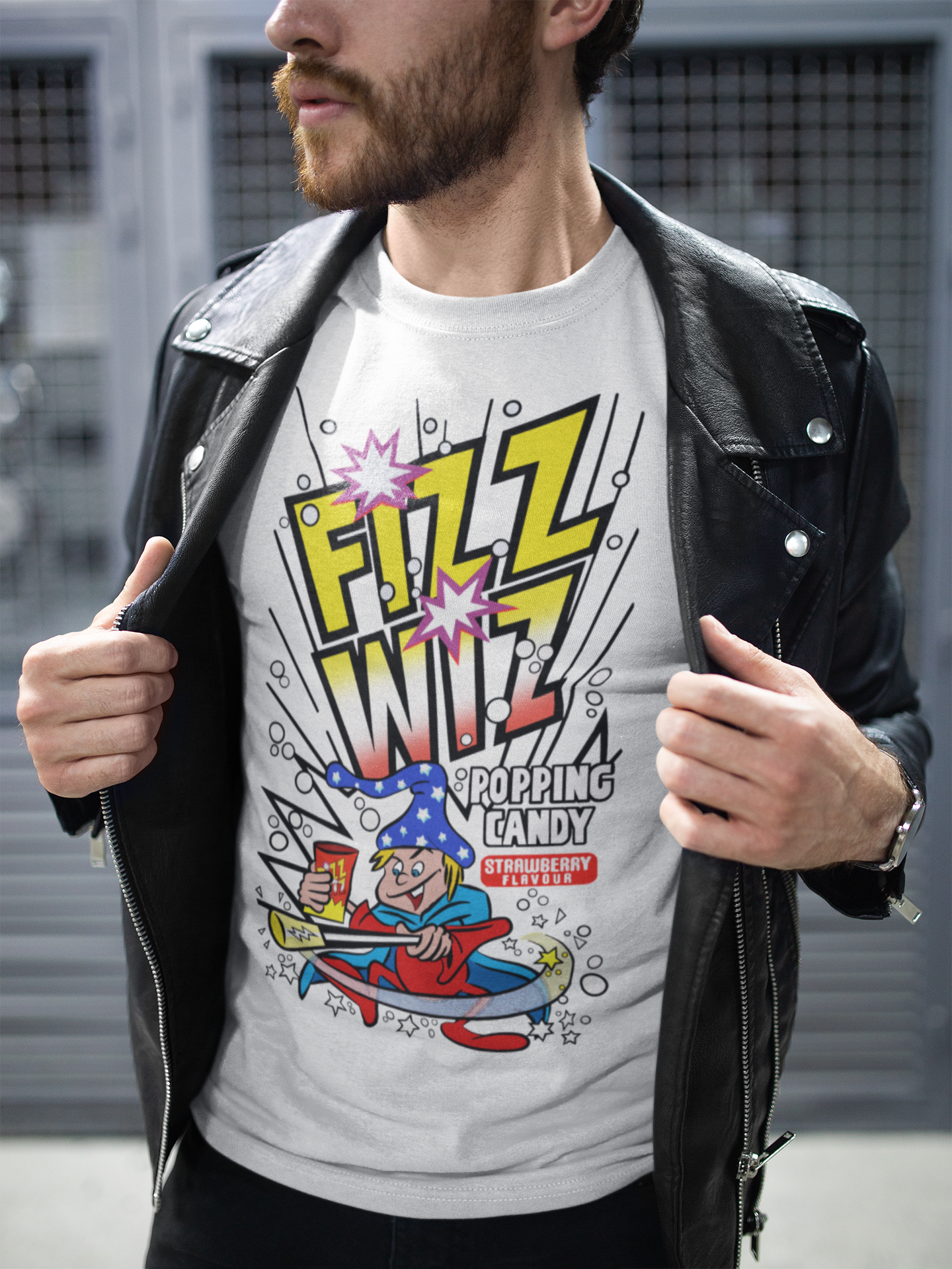Person wearing a short sleeve white t-shirt with retro 'Fizz Wiz' popping candy graphic design.