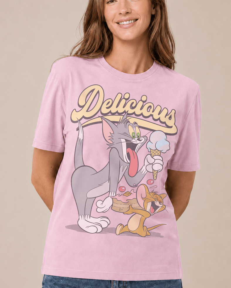 Woman wearing a Candy Pink Tom and Jerry Delicious retro graphic T-shirt