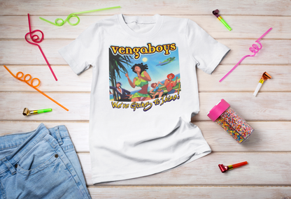 White t-shirt with 'Vengaboys' design on a wooden surface with party supplies.